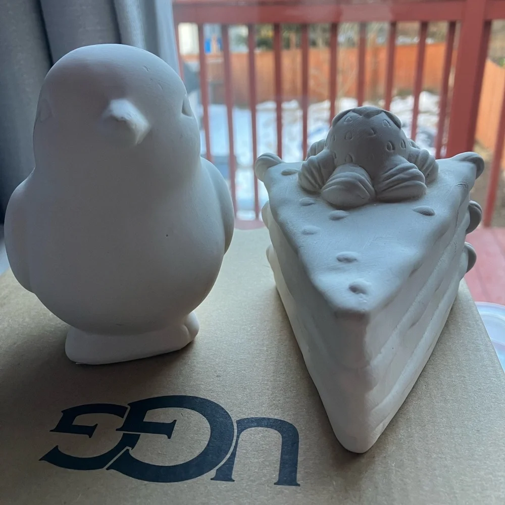 Unpainted bisque ceramic unfinished bird and strawberry cake figurines pottery